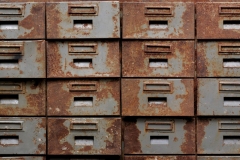 Backgrounds and textures: old rusty metal closet with pullout drawers, close-up shot